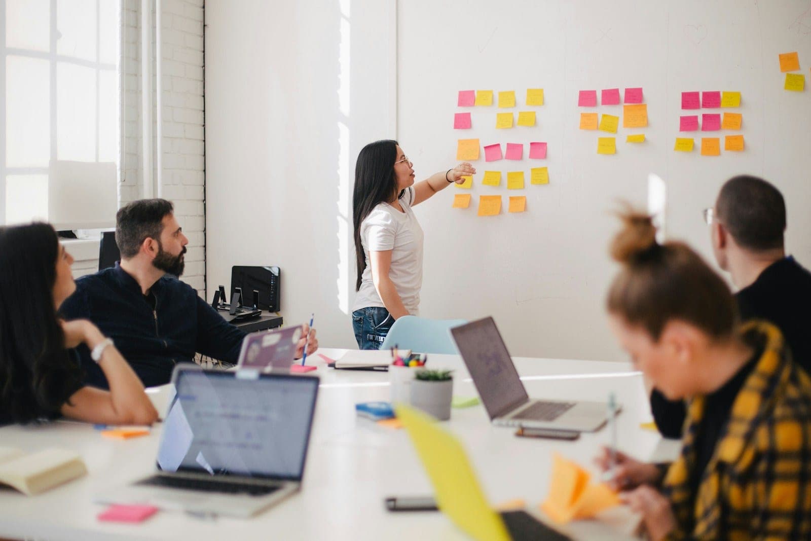 Strategic planning session — names and accounts mapped on glass